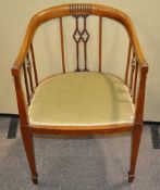 An Edwardian mahogany tub shaped chair