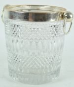 A large pressed glass and plated metal champagne bucket with side set ring handles,