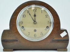 An oak cased mantel clock