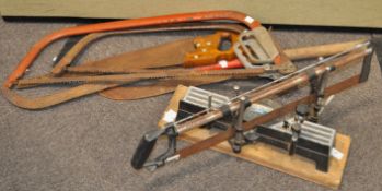 A mitre saw and various other tools