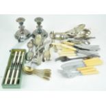 A collection of assorted silver plate and stainless flatware along with a pair of silver plated