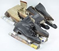 A pair of vintage racing skates together with two other pairs of ice skates