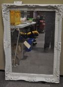 A large white painted mirror