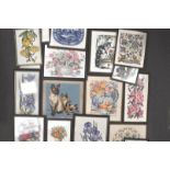 A group of framed embroideries and other items