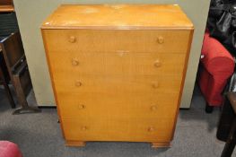 A chest of five graduated drawers