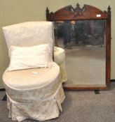 An upholstered chair and a mirror