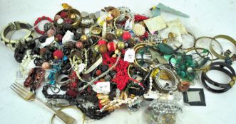 A collection of assorted costume jewellery bracelets, necklaces and more.
