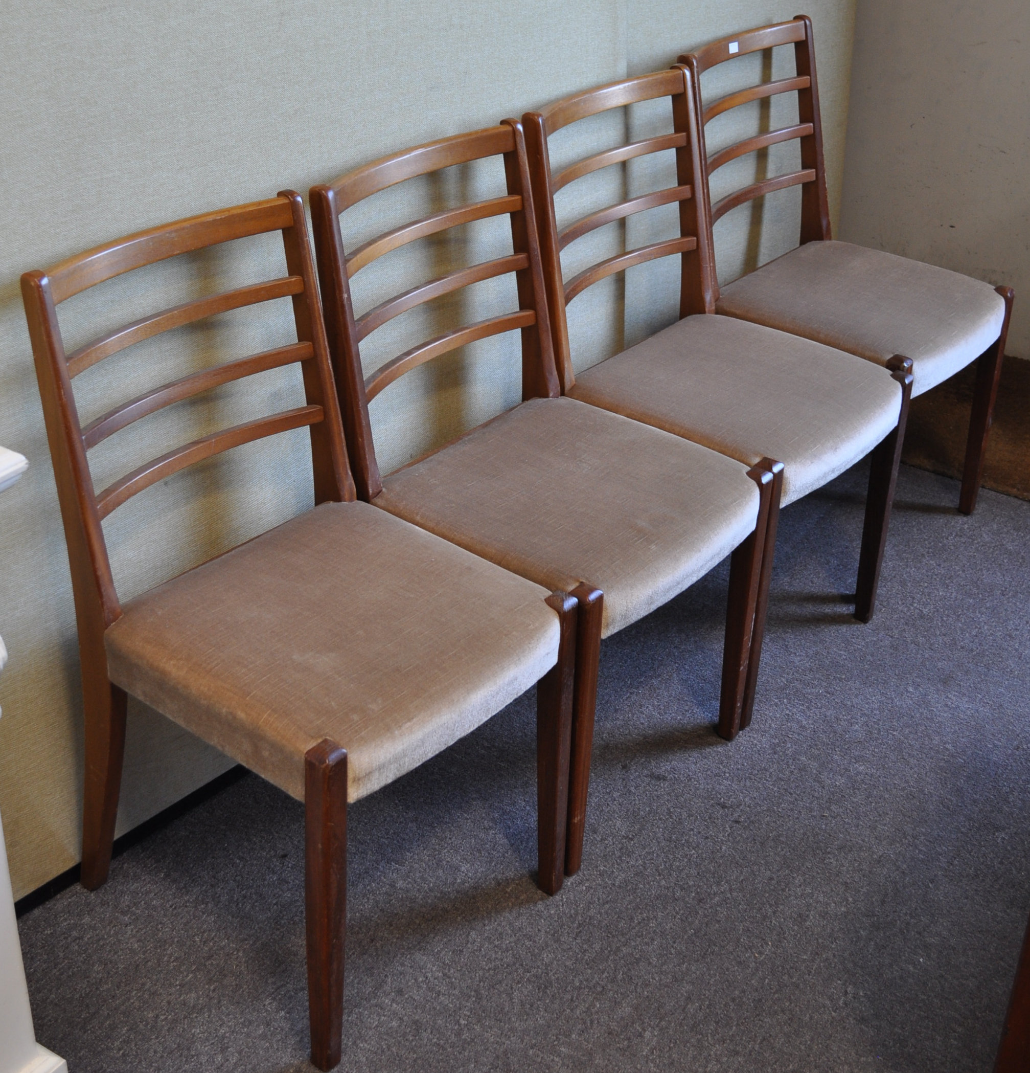 A set of four retro vintage teak wood dining chairs with ladder backs ,