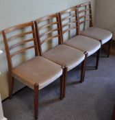 A set of four retro vintage teak wood dining chairs with ladder backs ,