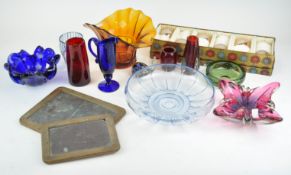 A group of coloured glassware, to include a blue jug,