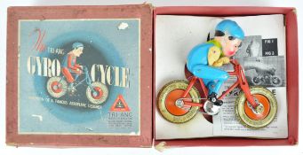 A boxed Triang tin plate and fabric gyro cycle toy,