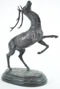 A 20th century bronze figure of a leaping stag, after Wilhelm Bormann,