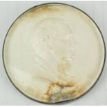 A cased and glazed silver medal,