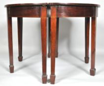 A pair of George III mahogany demi lune side tables, each on square tapering legs and spade feet,