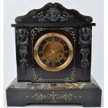 A Victorian slate and marble mantel clock, with applied bronze patinated mask mounts,