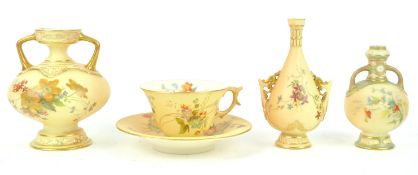 A Royal Worcester china works blush ivory cabinet cup and saucer, decorated with floral sprays,