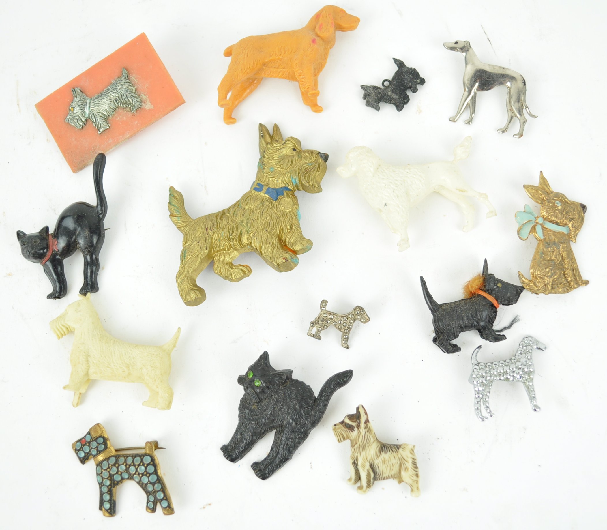 A collection of eight costume jewellery brooches in the form of dogs,