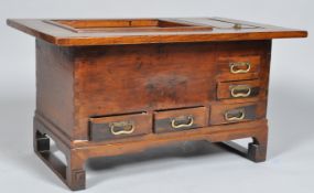 A 20th Century Japanese vintage keyaki wood hibachi coffee table having a two section lidded top