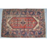 A Middle Eastern rug with central red panel,