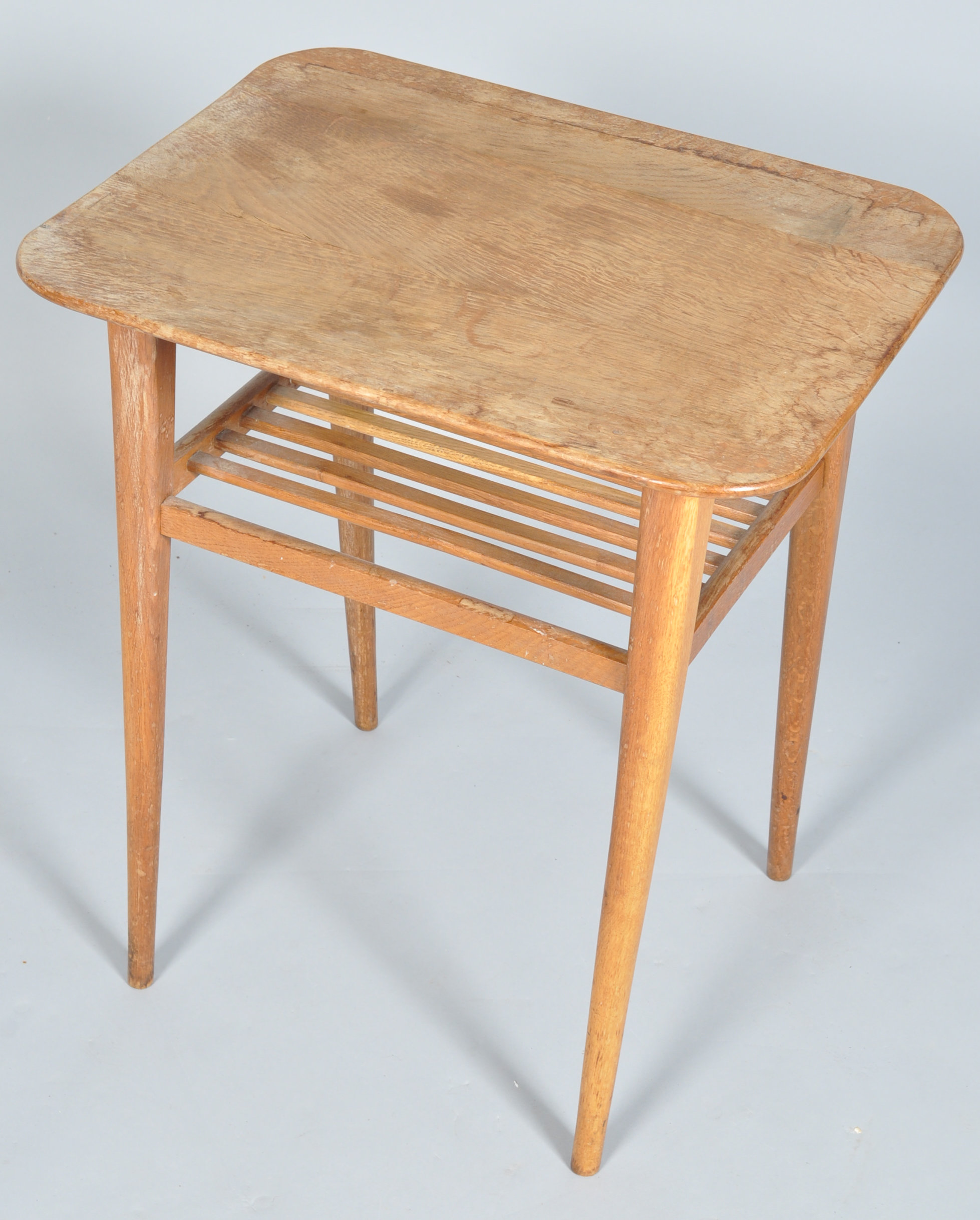 A mid 20th Century 1950's golden oak side table having a flared top above a slatted undertier and - Image 2 of 2