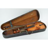 A violin in a 19th century ebonised case,