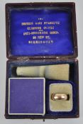 A boxed 9ct anti-rheumatic ring. 4.19 grams total weight.