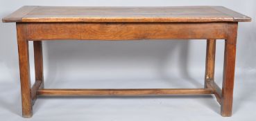 A triple plank top refectory table, the square chamfered legs united by an H stretcher,