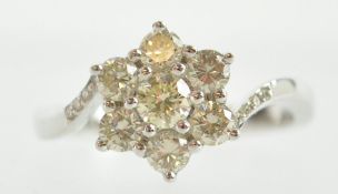 A white metal cluster ring.