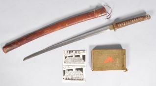 A WWII Second World War Showa Period Shin Gunto officers sword katana having a tsuka bound hilt