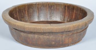 A large staved wooden mixing bowl with iron bindings,