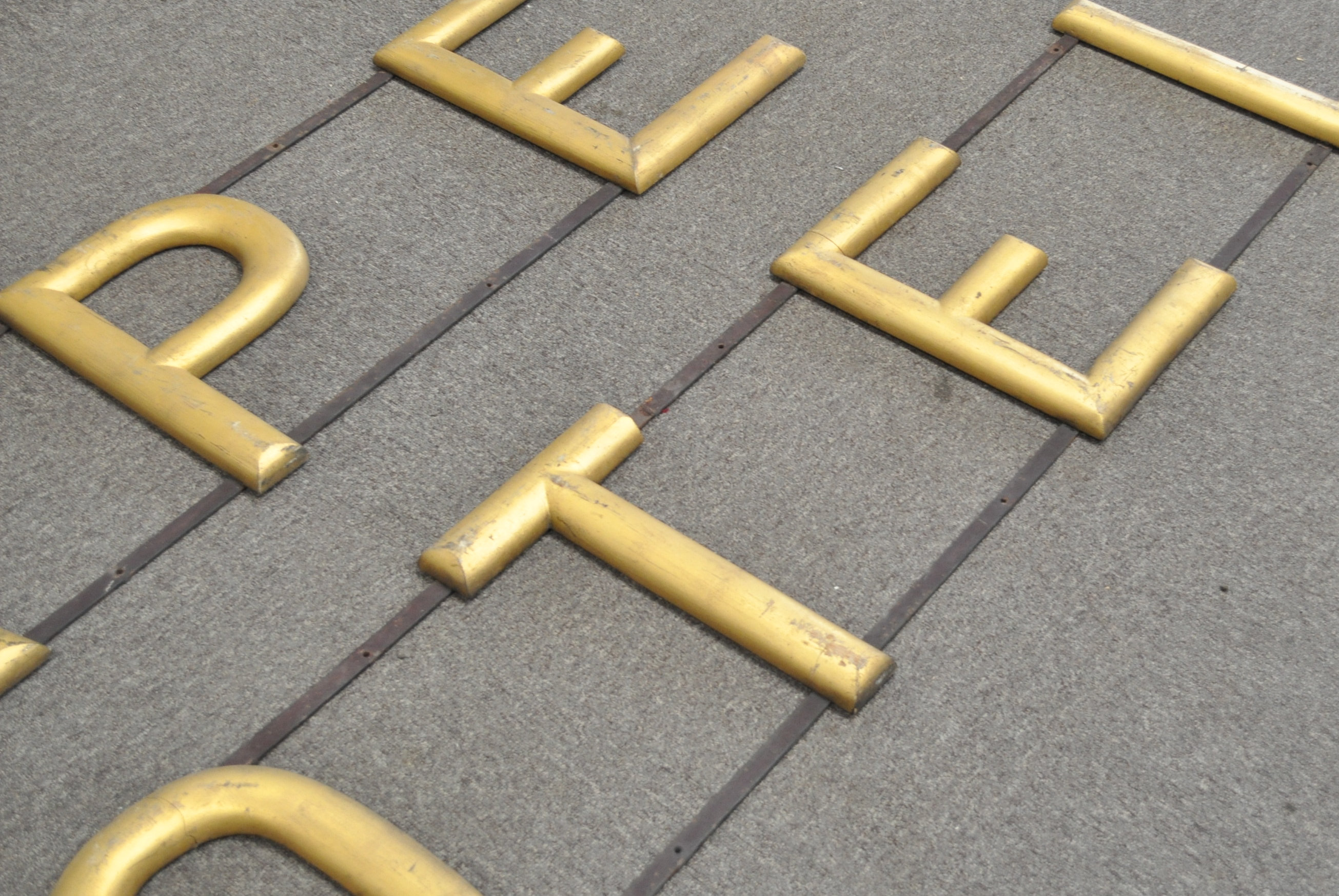 A 20th century retro vintage point of sale advertising sign comprising of gilt wooden letters fixed - Image 2 of 3