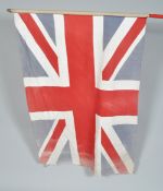 A post WWII Second World War Union Flag on cylindrical wooden pole. Measures; 101cm x 144cm.