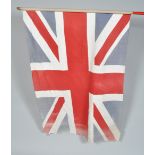 A post WWII Second World War Union Flag on cylindrical wooden pole. Measures; 101cm x 144cm.