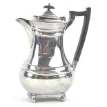 A silver plated coffee pot of shaped bulbous rectangular form,