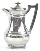 A silver plated coffee pot of shaped bulbous rectangular form,