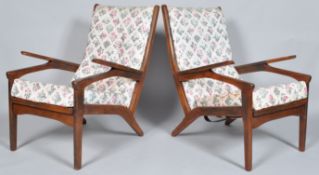 An unusual pair of 1960's Danish inspired retro vintage teak wood easy / lounge chairs / armchairs