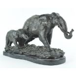 A bronze model of two elephants, after Antoine Louis Barye, on black marble plinth,