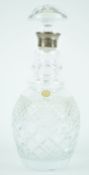 A Bleikrystall cut glass decanter and stopper, with silver mounted top and star cut base,