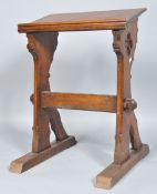 An oak lectern with pierced supports,