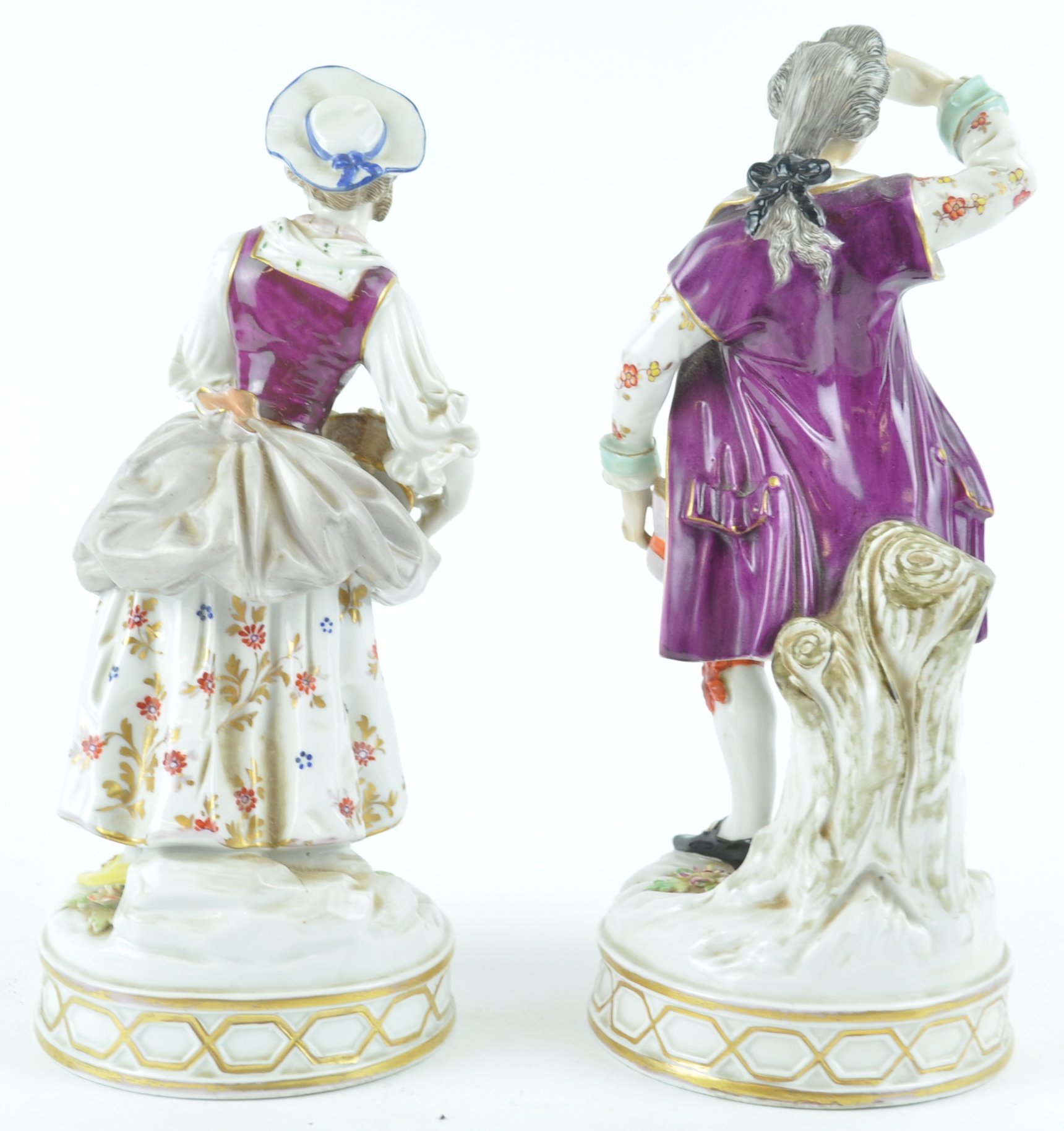 A pair of 19th century Continental porcelain figures of a lady holding a basket of flowers, - Image 2 of 3
