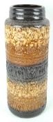 A West German cylindrical vase with textured decoration and brown glaze,
