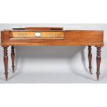 A George III mahogany square piano on turned legs,