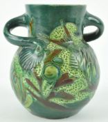 A William Baron Barnstaple pottery vase in green and brown glaze with sea form pattern fish,