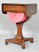 A 19th Century William IV ladies rosewood sewing table having a drop leaf top,