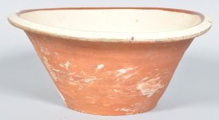 A 19th Century Victorian antique pancheon / dairy bowl being constructed from terracotta