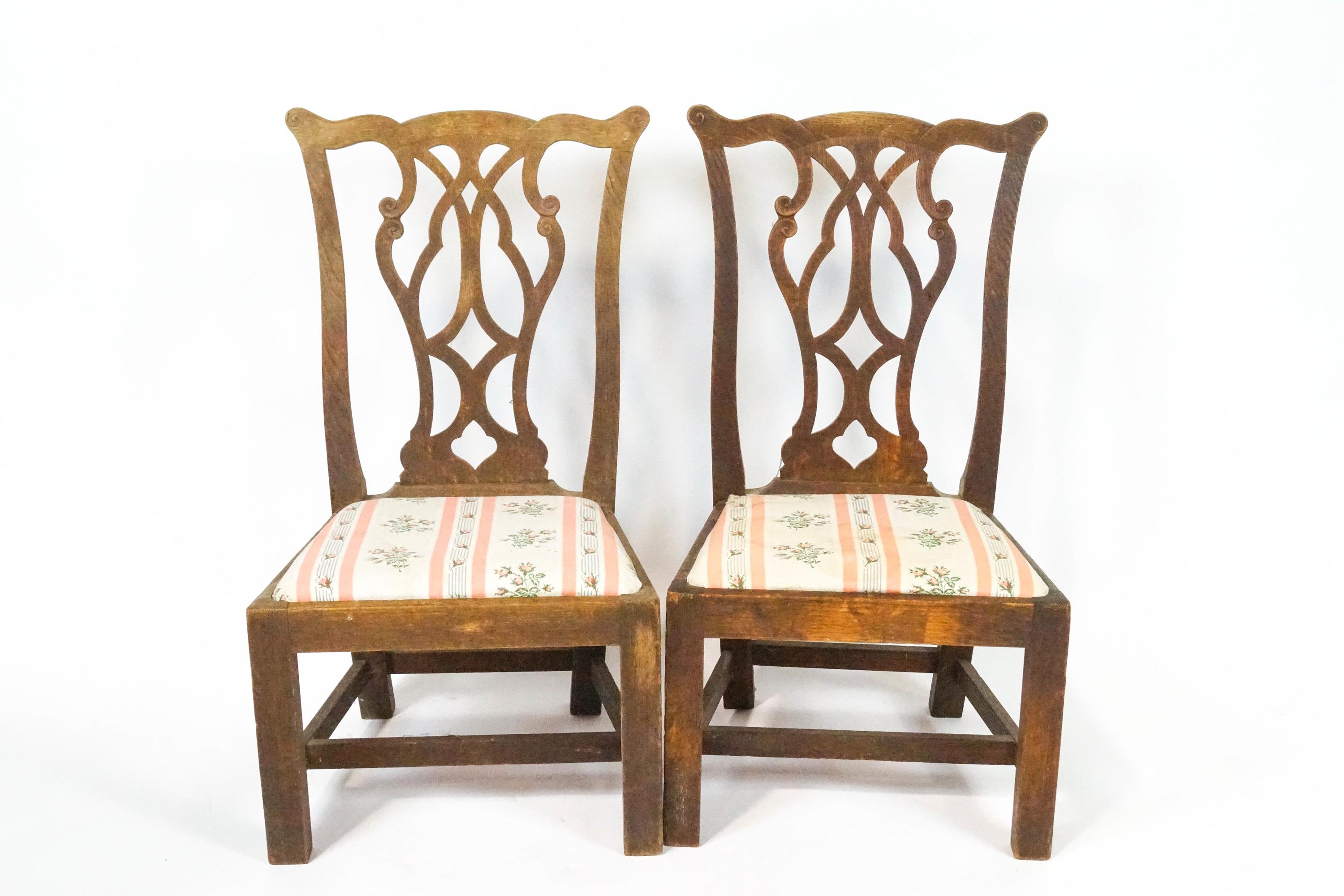 A pair of George III style oak child's chairs with pierced interlaced splats,