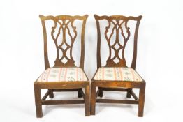 A pair of George III style oak child's chairs with pierced interlaced splats,