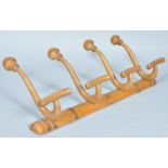 An early 20th Century antique vintage beech wood wall mounted coat rack