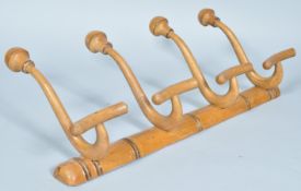 An early 20th Century antique vintage beech wood wall mounted coat rack