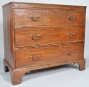 A 19th century mahogany chest of drawers with a brushing slide above three long drawers,